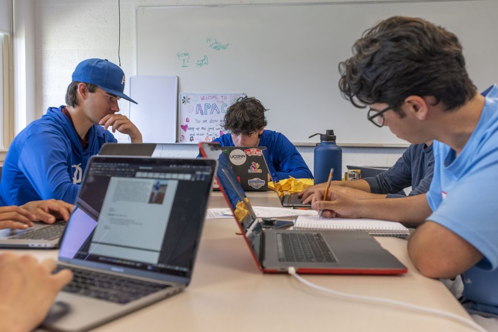 Student members of the Uconn Avery Point baseball team studying. April 14, 2022. (Sean Flynn)