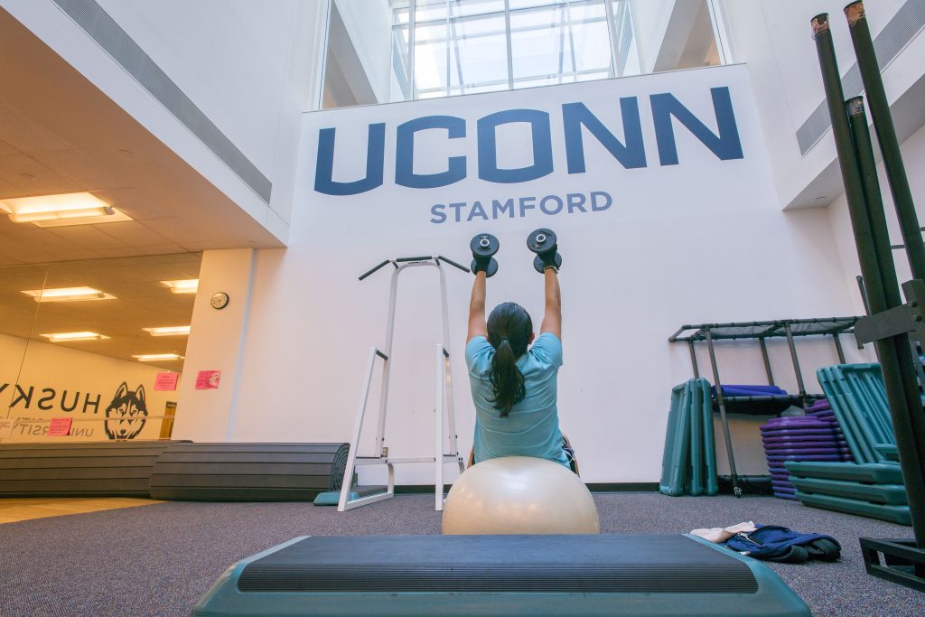 Student exercising (workout) in the gym at UConn Stamford on Oct. 9, 2018. (Sean Flynn/UConn Photo)