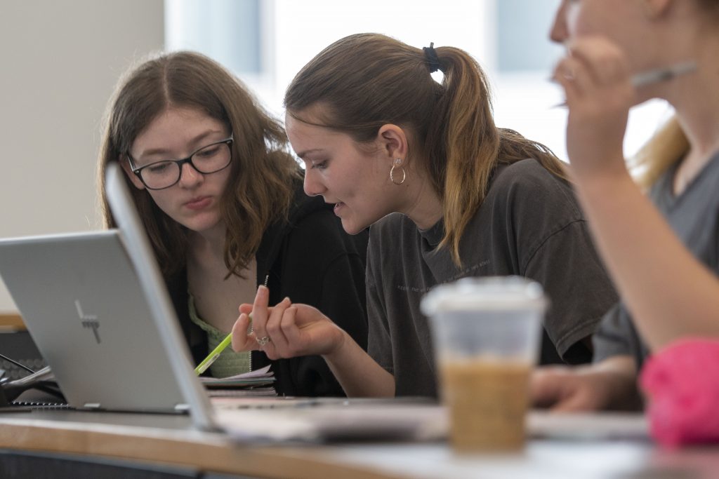 UConn Hartford students listening to a lecture in a classroom April 13, 2022. (Sean Flynn)