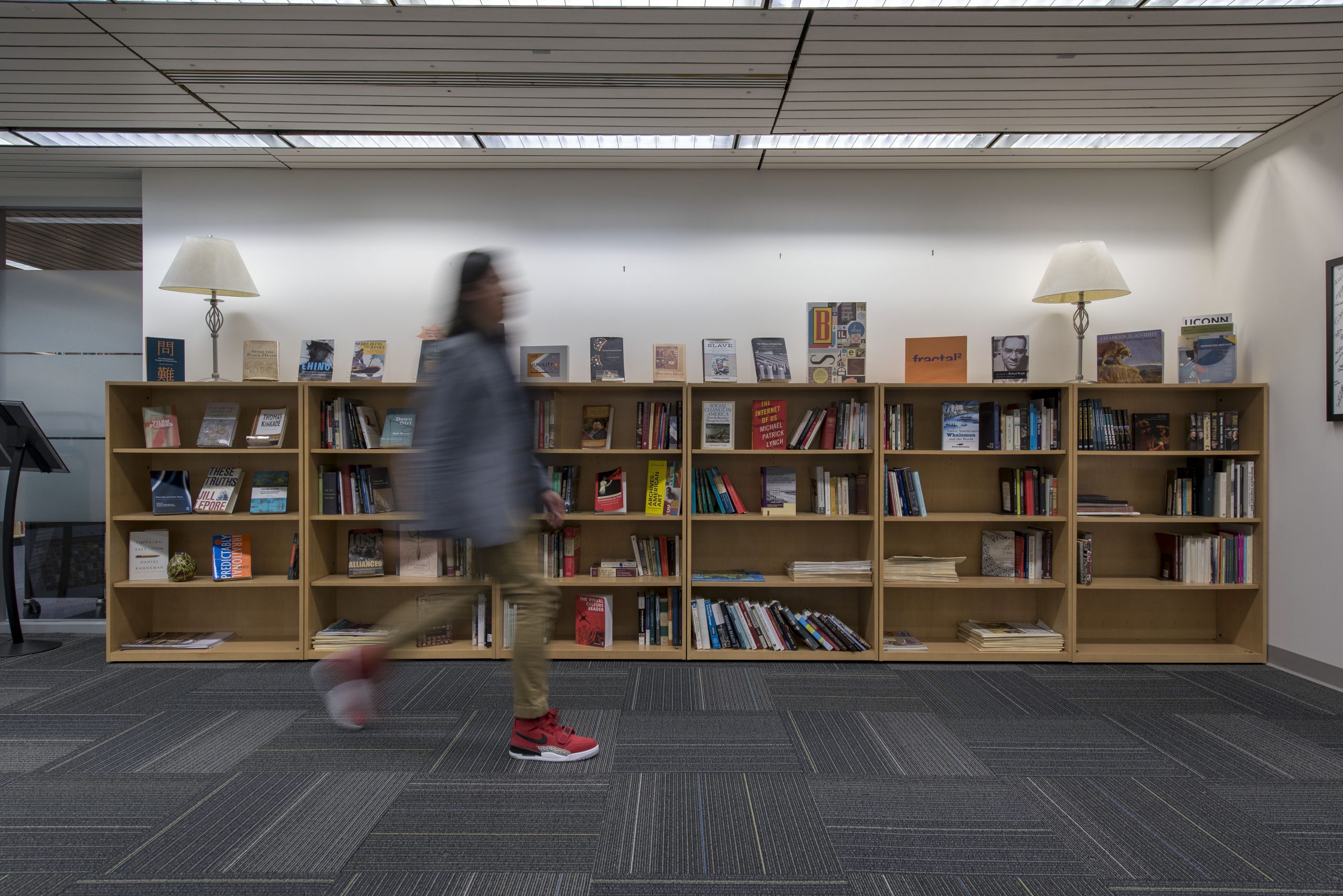 Bookshelf containing books written by past and present faculty of the Humanities Institute on Jan. 30, 2019