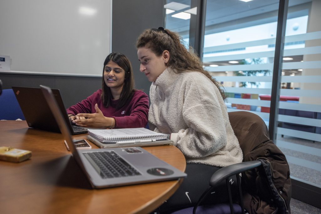 Students working on a group project at the UConn Stamford Library. Feb. 2, 2023. (Sean Flynn/UConn Photo)