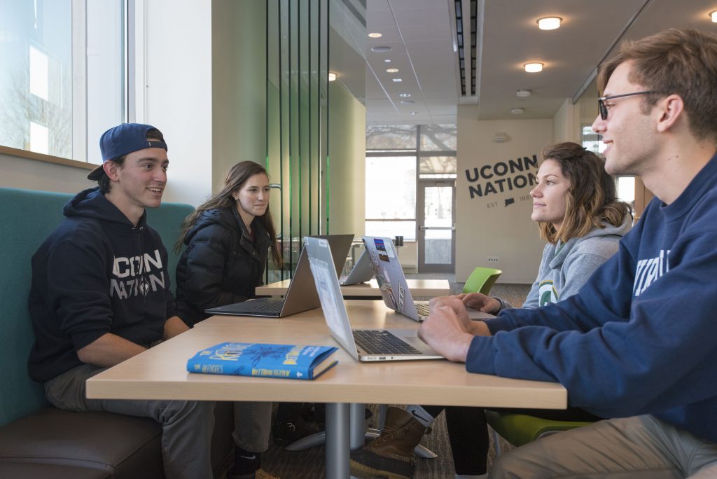 Students talking in the Student Center at UConn Avery Point on Dec. 14, 2017. (Sean Flynn/UConn Photo)