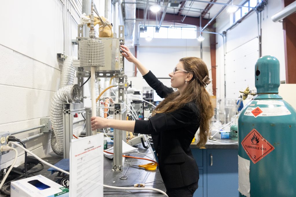 Caitlin Noonan '26 (ENG) works at her work station in UConn's Center for Clean Energy Engineering in the Mansfield Depot campus on Wednesday, April 9, 2025. (Sydney Herdle/UConn Photo)