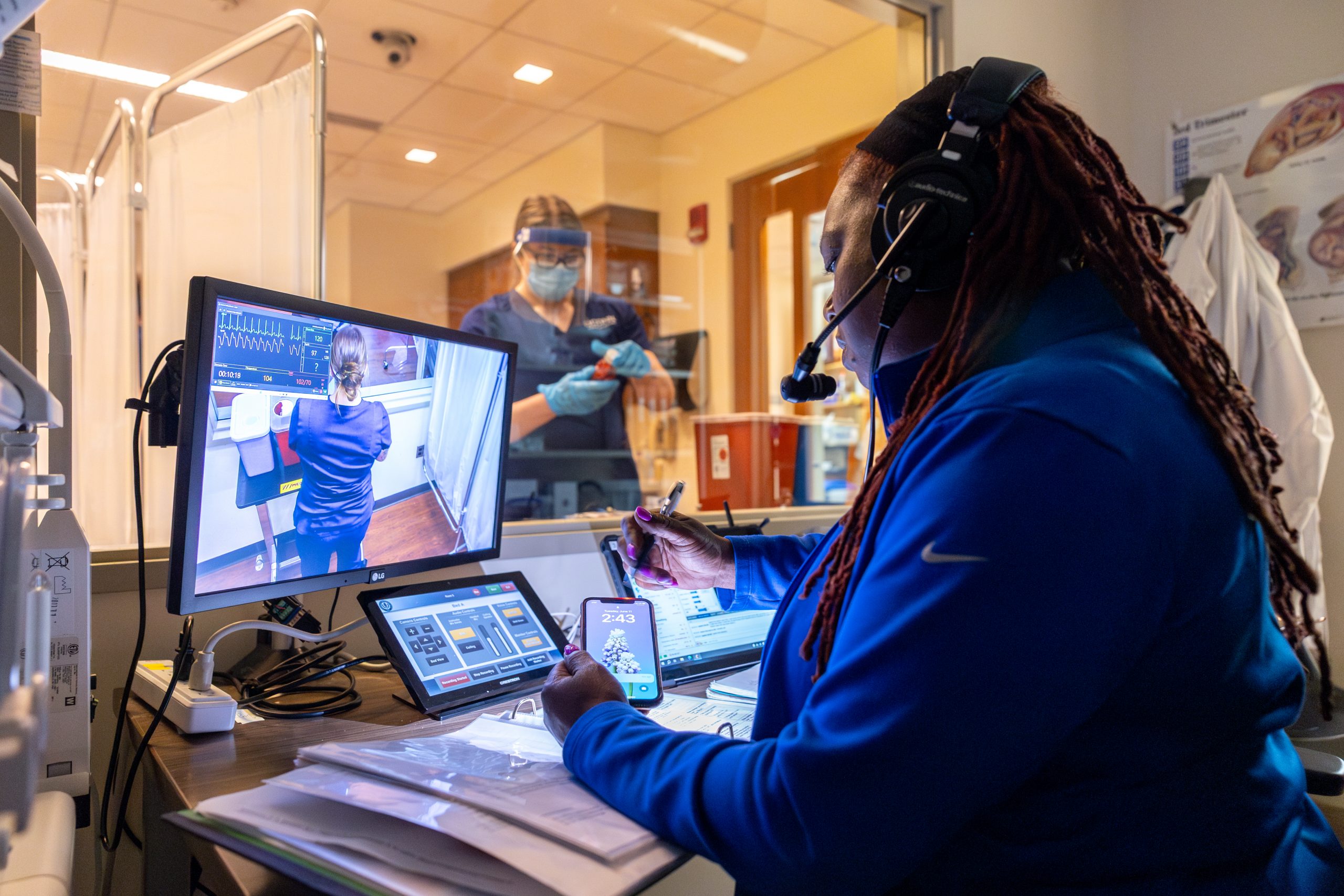 UConn nursing students participate in a simulation in the nursing simulation lab in the Widmer Wing of Storrs Hall on June 11, 2024. (Sydney Herdle/UConn Photo)