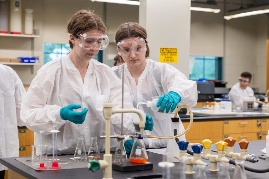 students work in one of the Chemistry Building labs during the Early College Experience Chemistry Student Lab