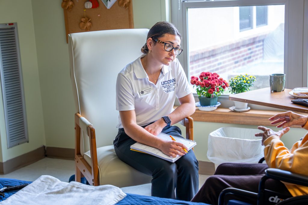 Students in Clinical Dietetics Practicum I (DIET 3155) in the Department of Allied Health Sciences (AHS) in the College of Agriculture, Health and Natural Resources (CAHNR) visit with patients to discuss healthy eating at the Mansfield Center for Nursing and Rehabilitation in Storrs.