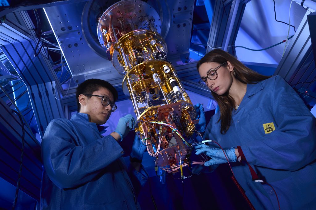 two scientists working with a quantum computer