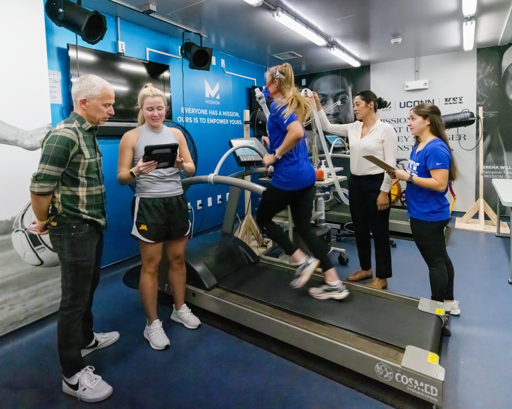 Doug Casa and Elaine Lee of the Department of Kinesiology in the College of Agriculture, Health and Natural Resources set up a research study in Korey Stringer Institute’s MISSION Heat Lab in Gampel Pavilion (GAMP). 