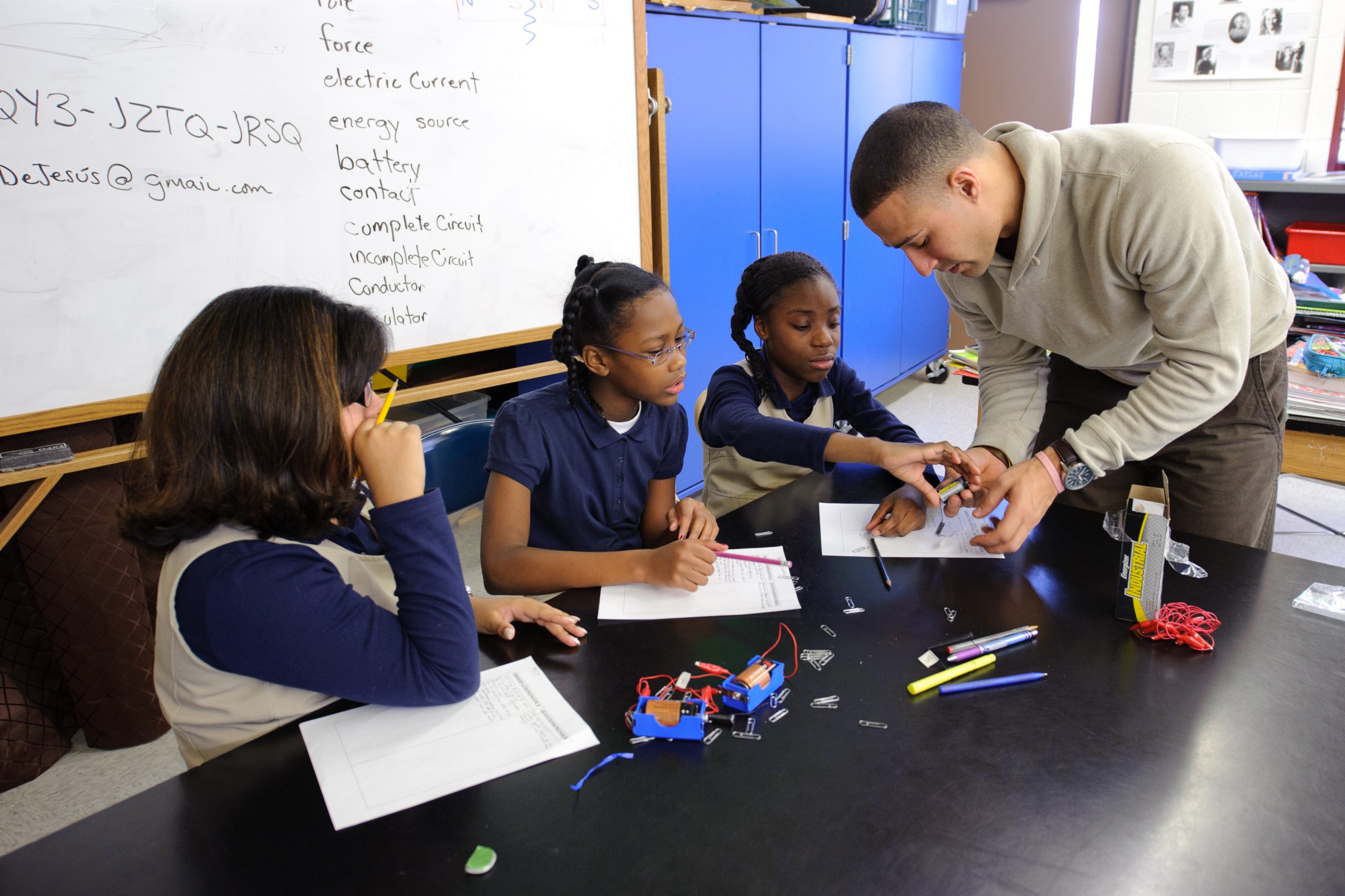 Fourth-graders perform an electromagnetic experiment with the help of their teacher Freddie DeJesus at Dr. Joseph S. Renzulli Gifted and Talented Academy in Hartford