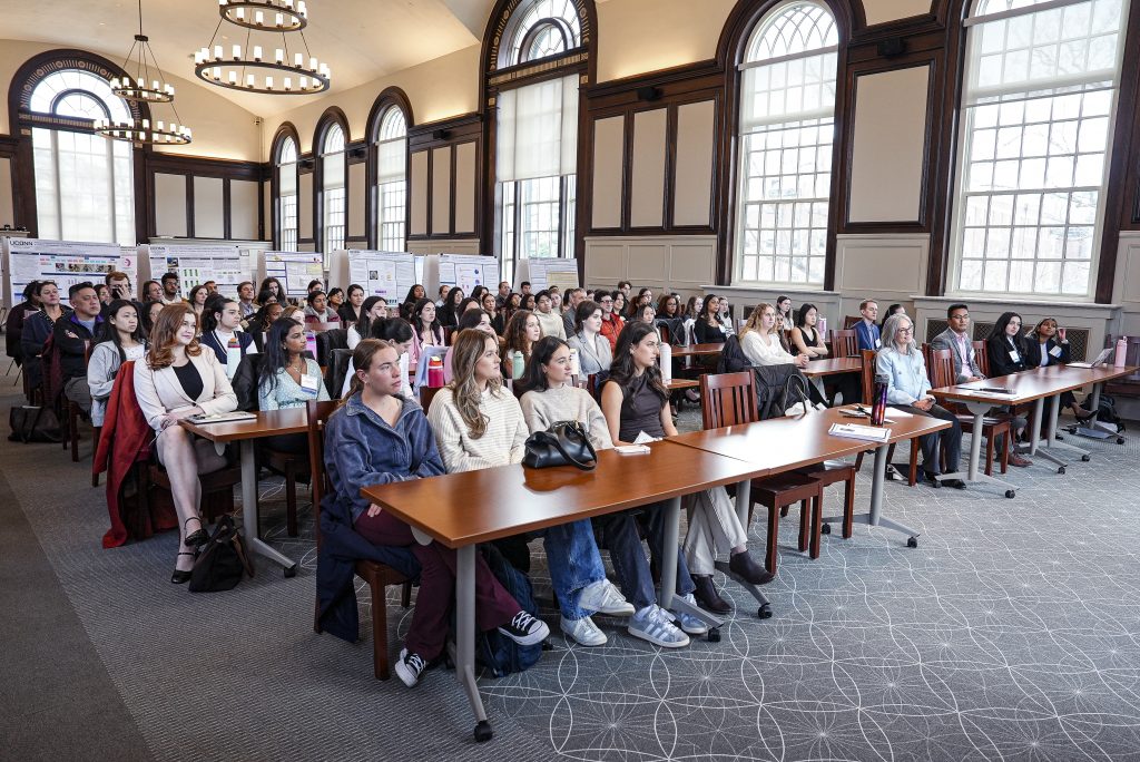 Group of people attending a lecture at an Annual Honors Research Forum event in the North Reading Room of the Wilbur Cross Building, UConn.